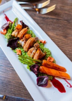 Portrait of a plate of Arroz con camarones food on the restaurant table